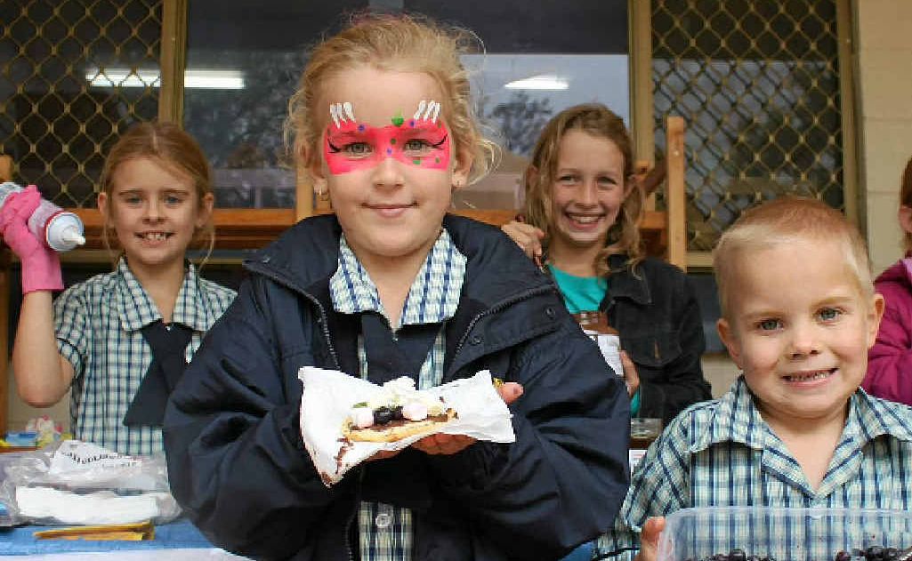Christian College students (front, from left) Niamh Ryan, Couper Clifford, (back) Nella Ryan and Keneisha Finch made delicious pikelets for hungry fair patrons at the weekend. Christian College students (front, from left) Niamh Ryan, Couper Clifford, (back) Nella Ryan and Keneisha Finch made delicious pikelets for hungry fair patrons at the weekend.